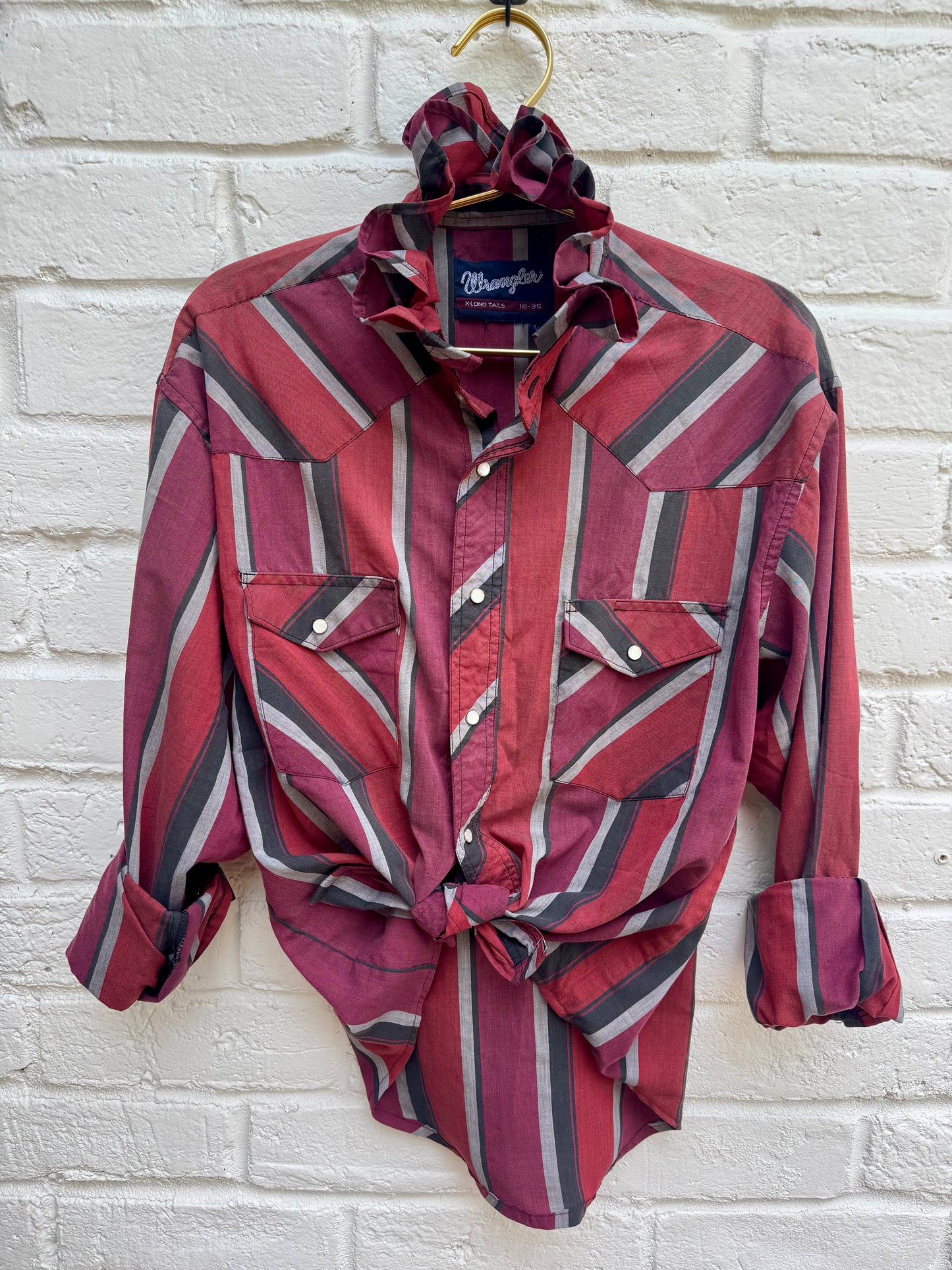 Vintage Wrangler Striped Ruffle Collar Western Pearl Snap Shirt X-Long Tails Red Grey- Well Worn. Measures 22.5 “ from pit to pit.