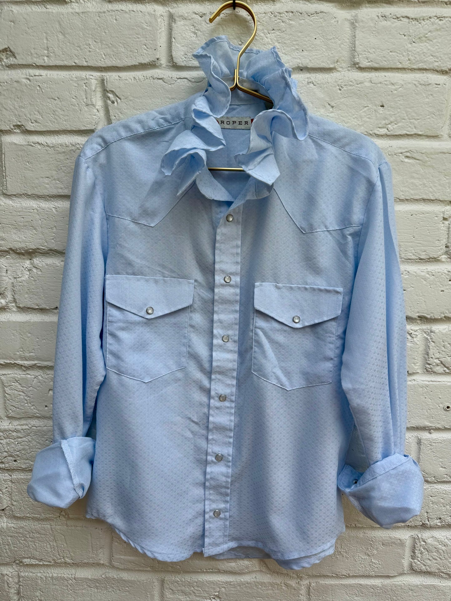 Vintage Roper Light Blue Ruffle Collar Western Pearl Snap Shirt Retro Cowgirl- Size S. Measures 20” from pit to pit.
