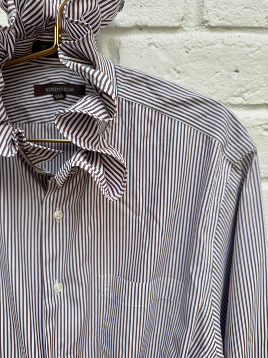 Elevate your wardrobe with this reworked Nordstrom striped button-down shirt, featuring a statement ruffle neck collar and a stylish front-tie waist.- Size Men’s 15.5. Pit to Pit 21”. Sleeve length 23”