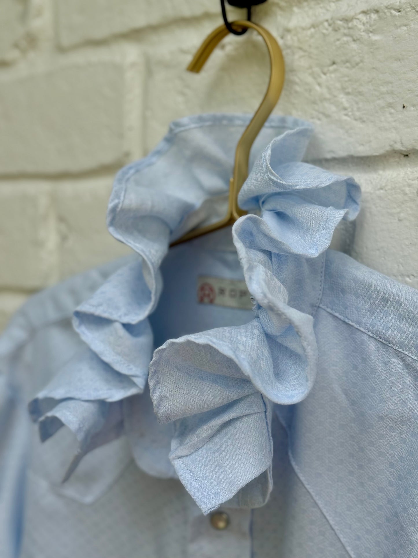 Vintage Roper Light Blue Ruffle Collar Western Pearl Snap Shirt Retro Cowgirl- Size S. Measures 20” from pit to pit.
